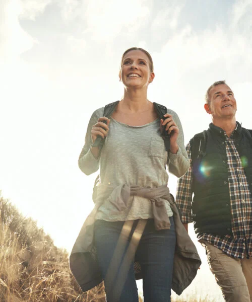 Shot of a mature couple hiking through the mountains